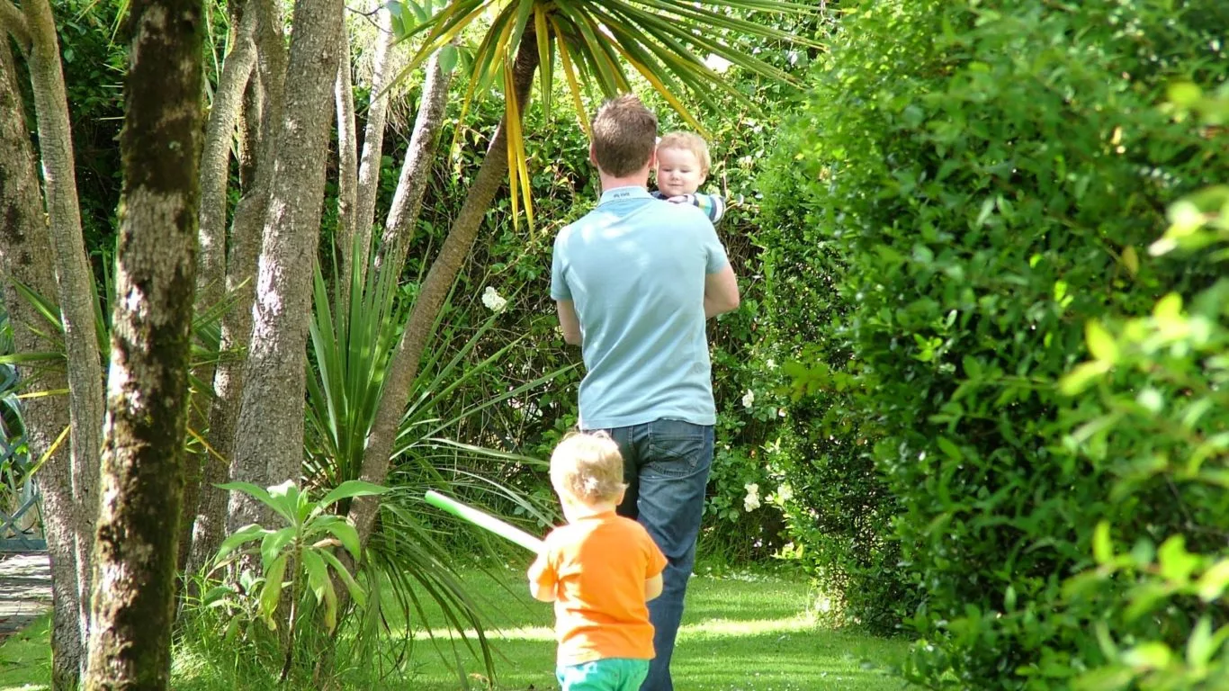 family-walking-gardens-at-kellys