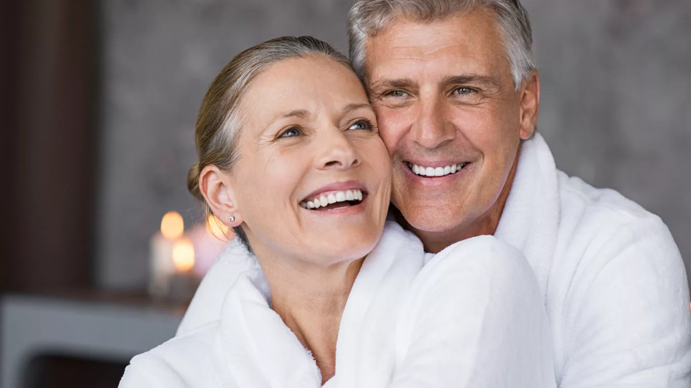 Smiling,Husband,Embracing,Cheerful,Wife,From,Behind,At,Spa.,Laughing