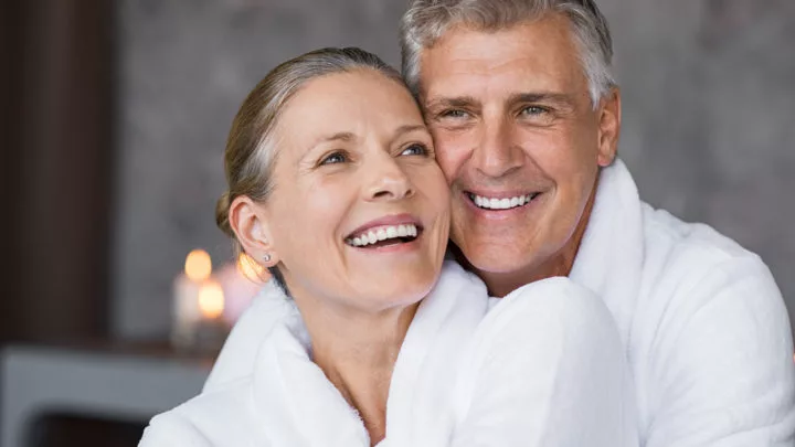 Smiling,Husband,Embracing,Cheerful,Wife,From,Behind,At,Spa.,Laughing